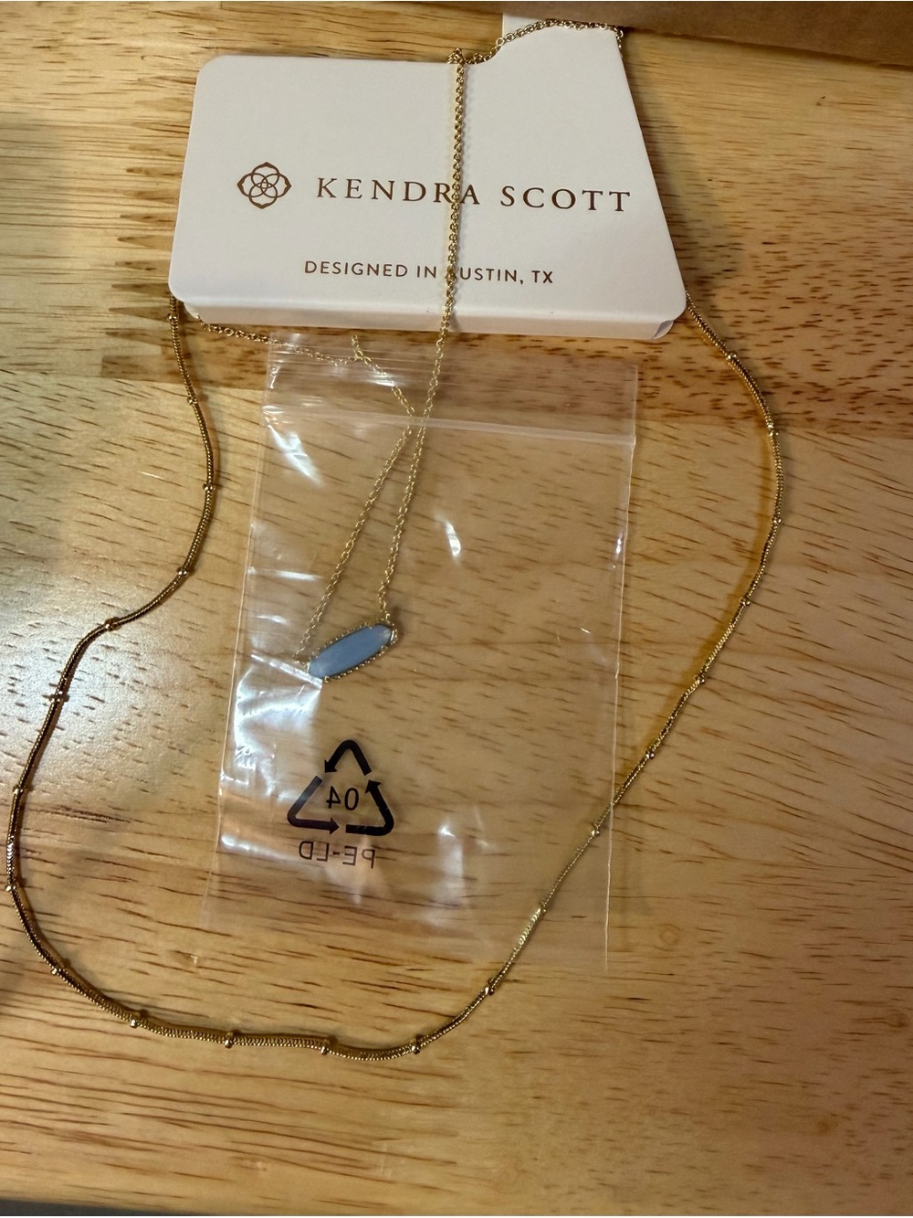 Kendra Scott Gold Necklace with Pale Blue Pendant